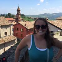 Image of Jessica Carroll with Italian town in the background.
